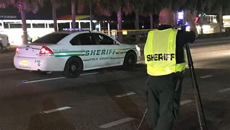 Lakeland pedestrian killed after running in front of Polk patrol car .